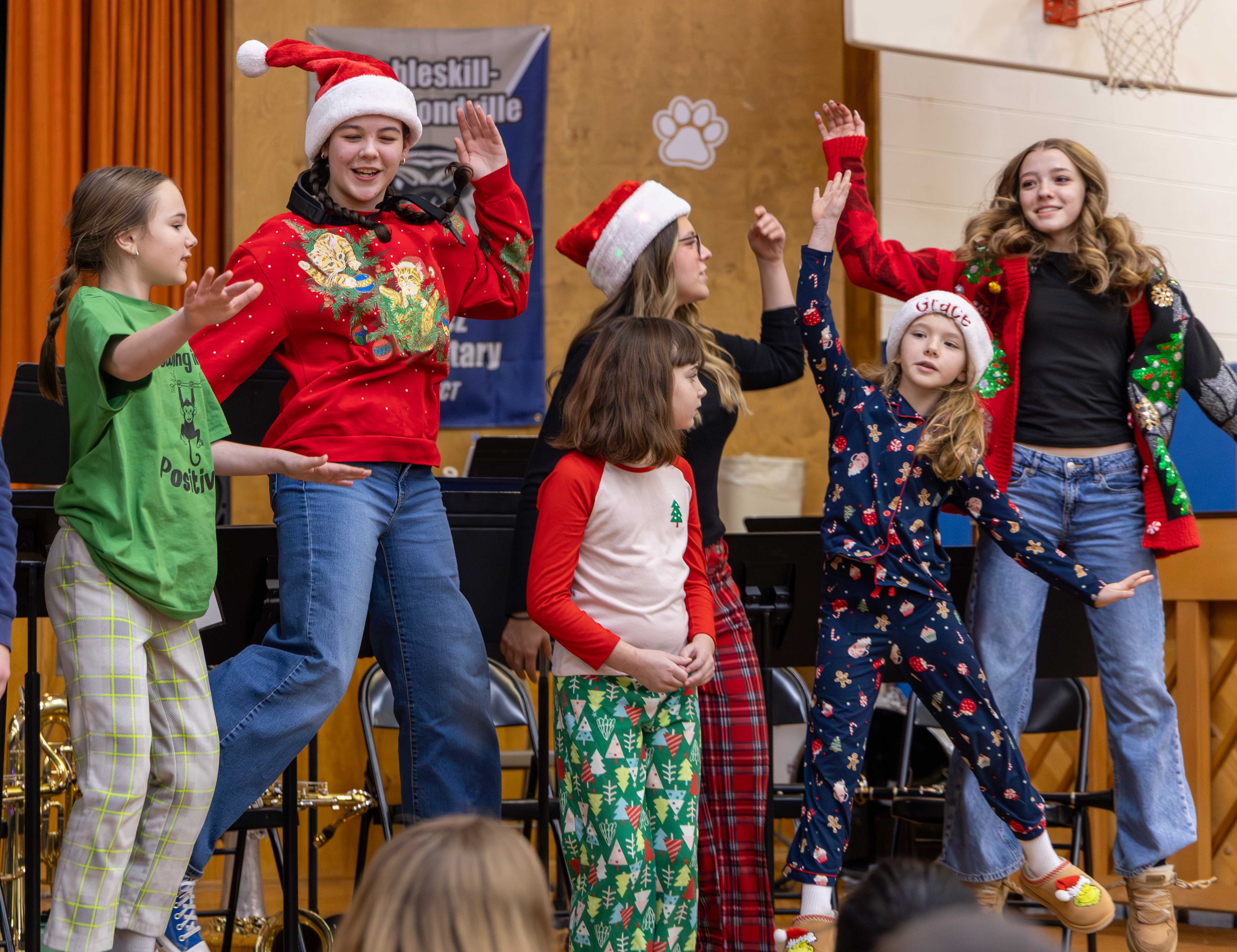 Radez and HS students jump during a group sing-a-long of Twelve Days of Christmas